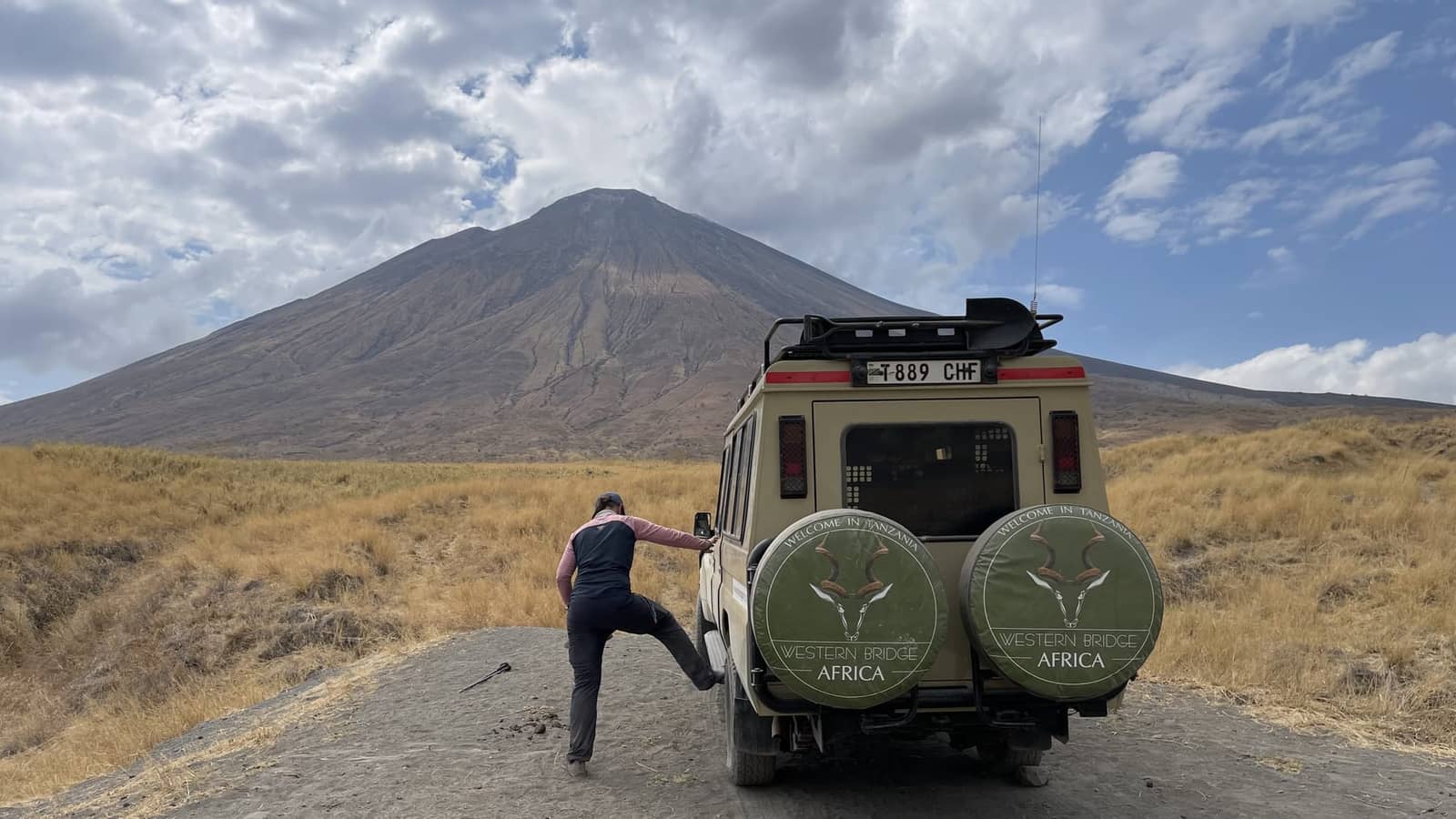 Western Bridge Africa safari vehicle below Ol Doinyo Lengai
